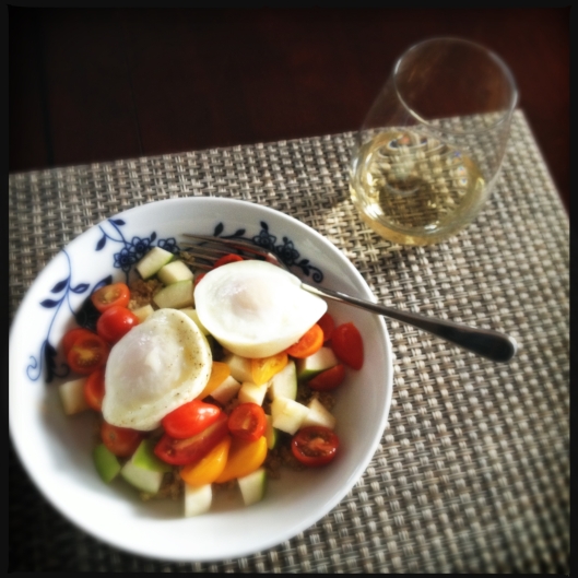 Poached eggs over quinoa, green apples and grape tomato's with a side of white wine is a delightful dinner option